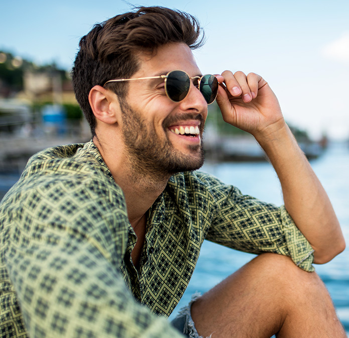 smiling man with sunglasses on