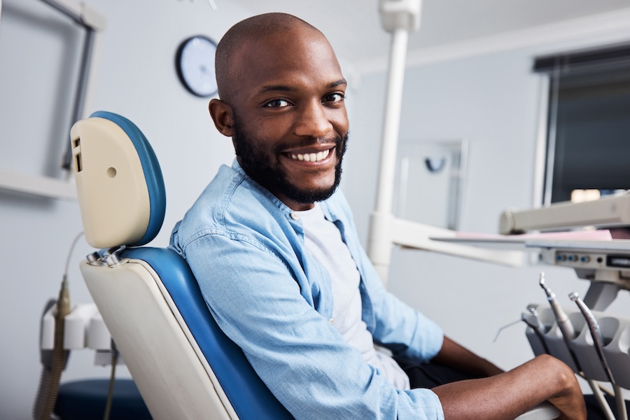 man sitting in dental chair