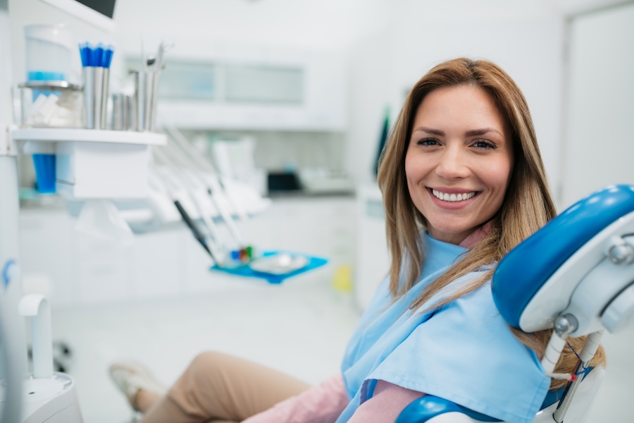 woman in dental chair, how to choose a new dentist